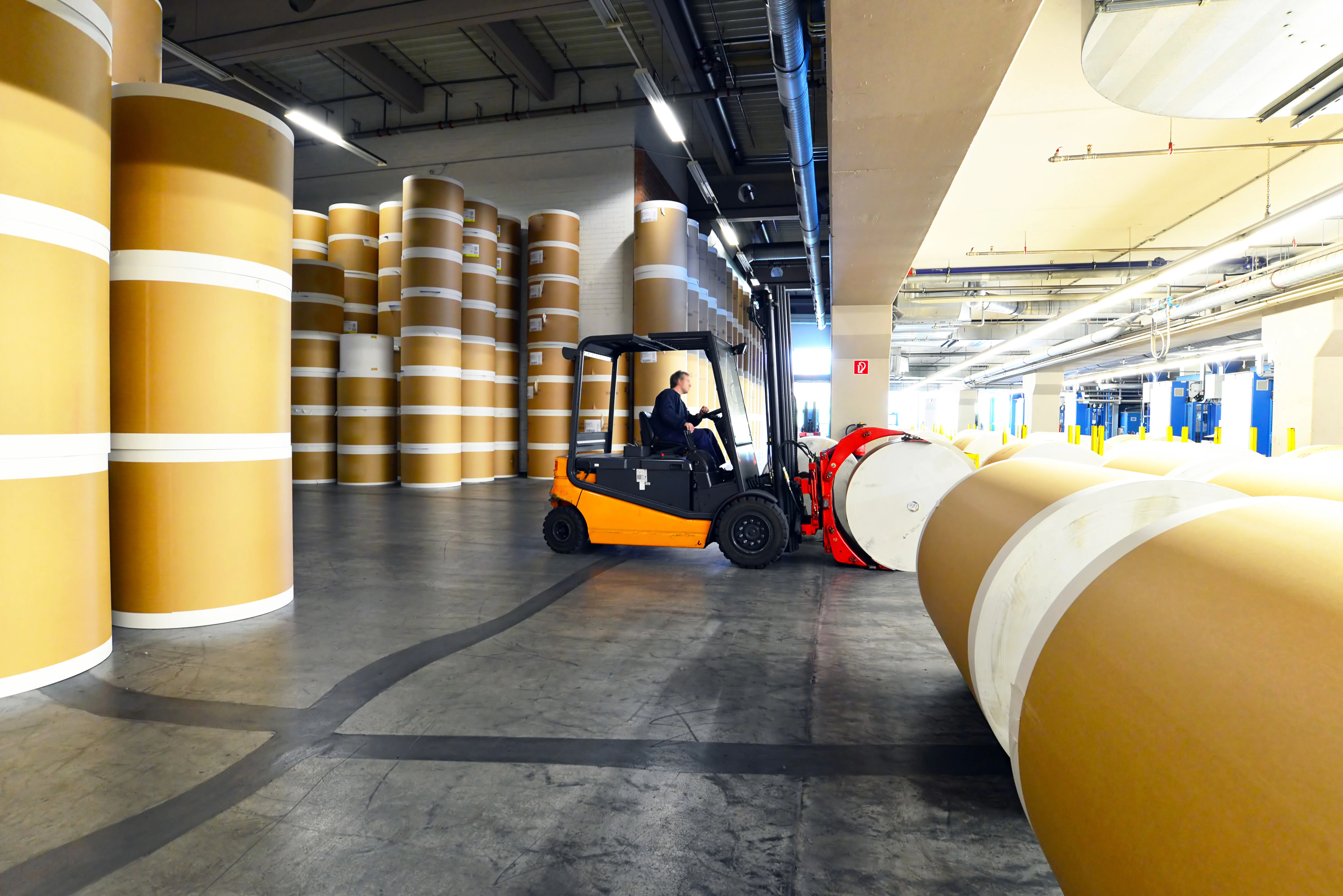 Paper rolls are stacked in the warehouse. Paper rolls are stacked in the warehouse.